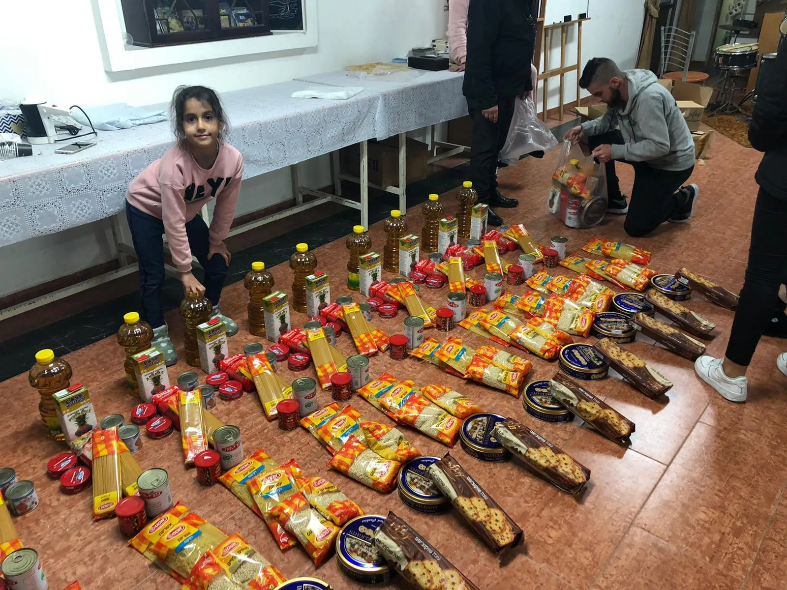 Church volunteers preparing grocery parcels for families in Nazareth