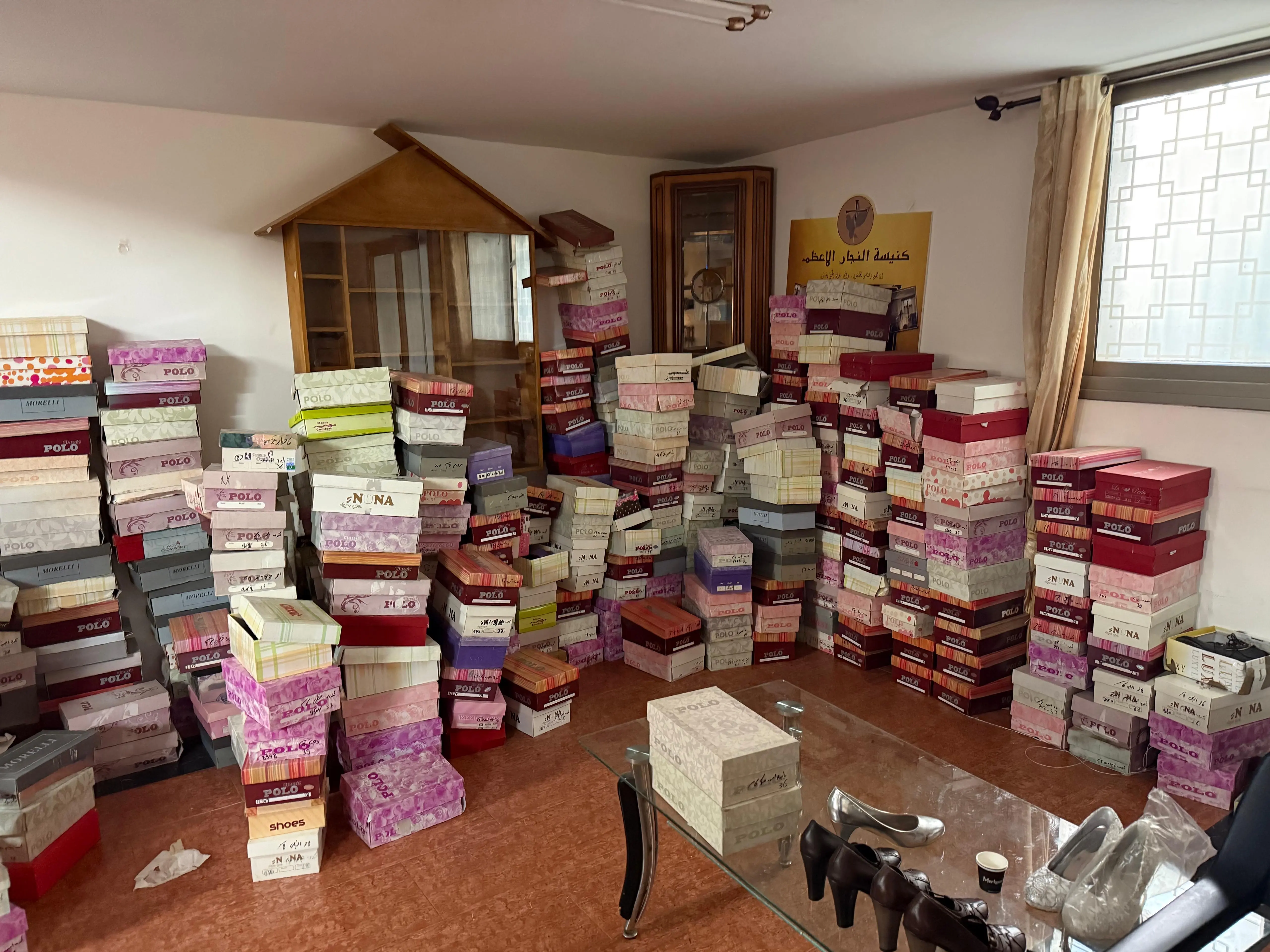 Hundreds of shoe boxes collected at the church, ready to be given to children and families